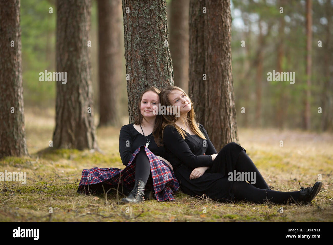 Girls sitting in the forest hi-res stock photography and images - Alamy