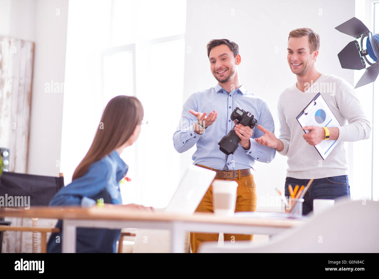 Positive colleagues talking Stock Photo