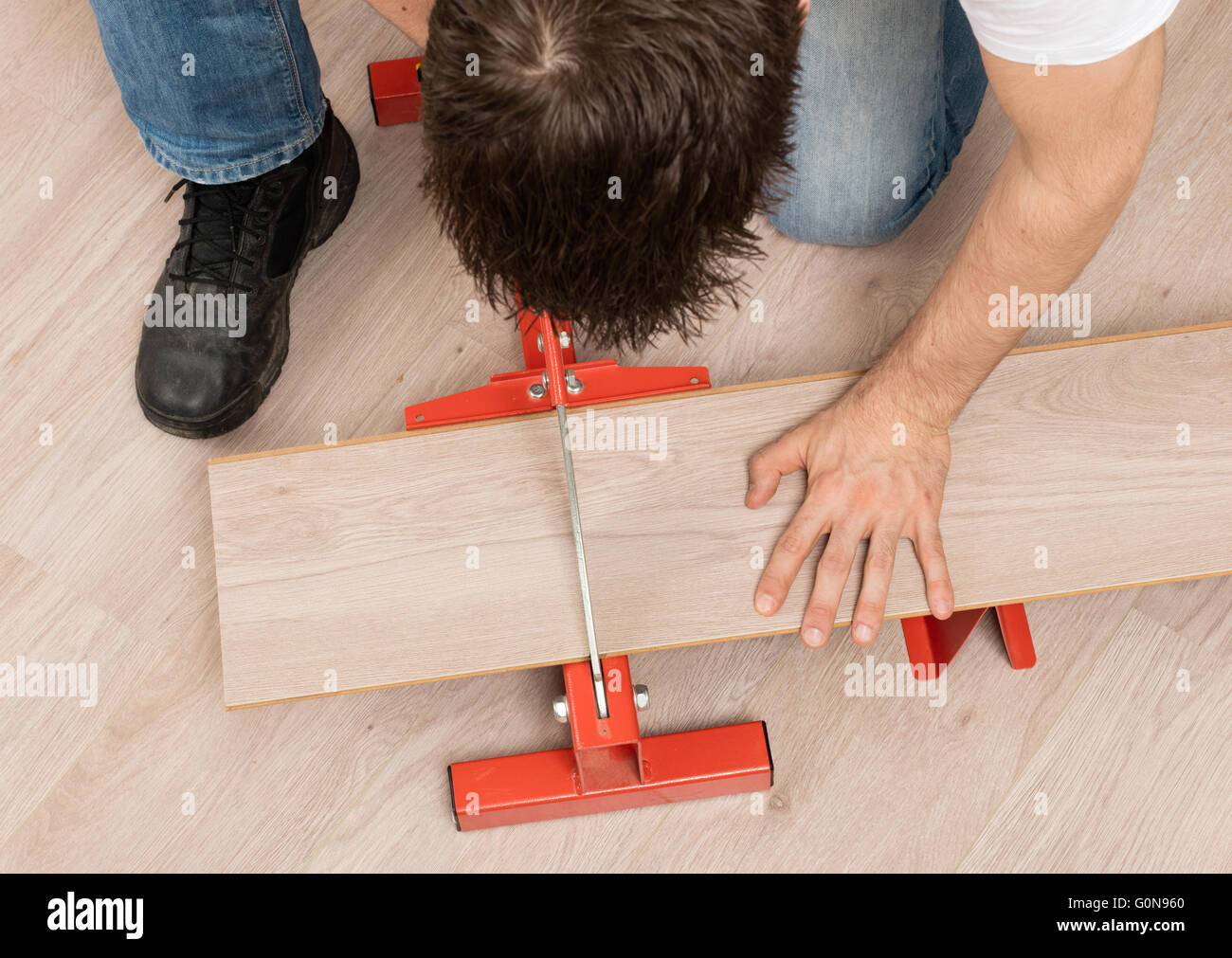 Red Tool For Cutting Laminate On A Laminate Floor Stock
