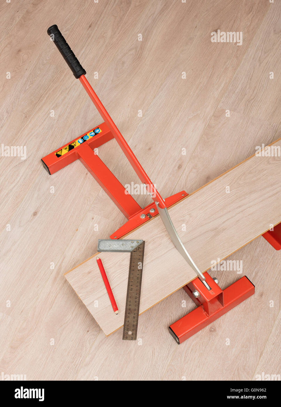 Red Tool For Cutting Laminate On A Laminate Floor Stock Photo