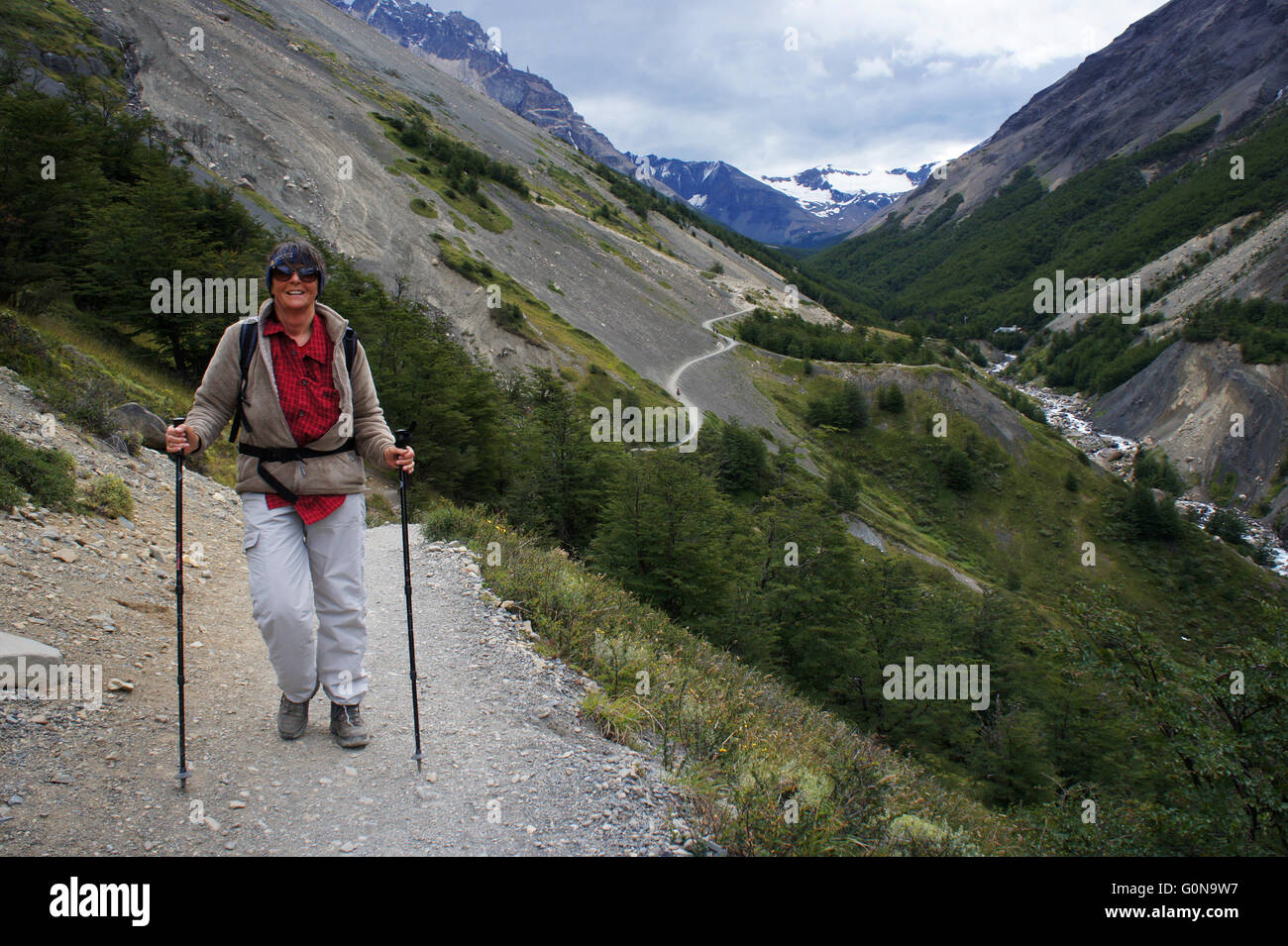 Hiker on way to Mirador Las Torres, Refugio e Camp Chileno (center),Torres del Paine National Park, Patagonia, Chile Stock Photo