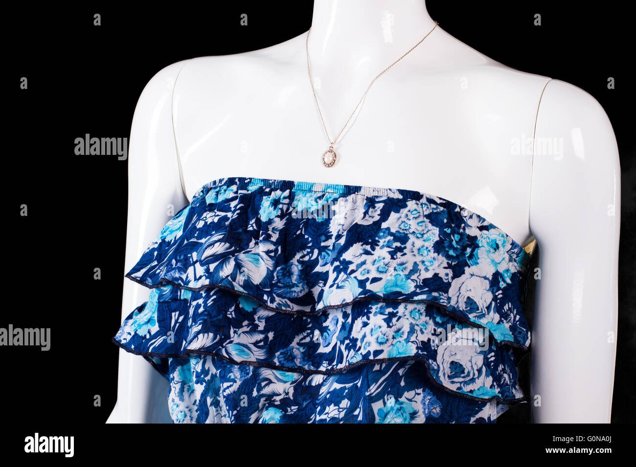 Strapless blue dress and pendant. Stock Photo