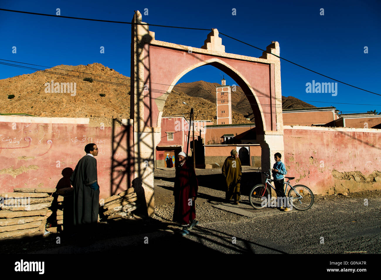 People outside a mosque in Tafrout region in the Anti-Atlas Stock Photo