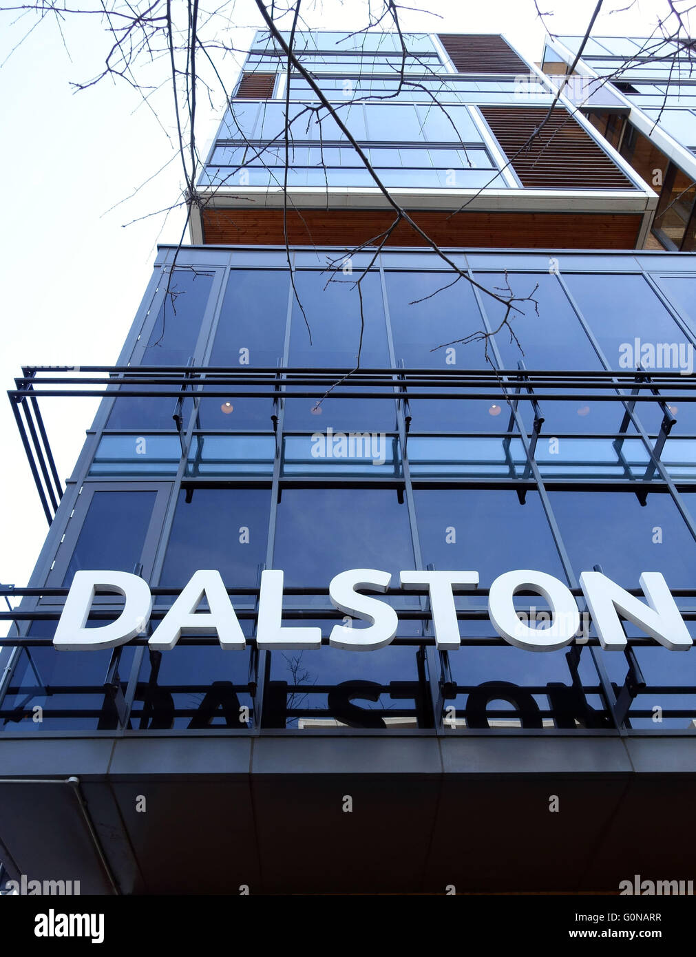 Gentrification in Dalston, East London - sign on C L R James Library in Dalston Square Stock Photo