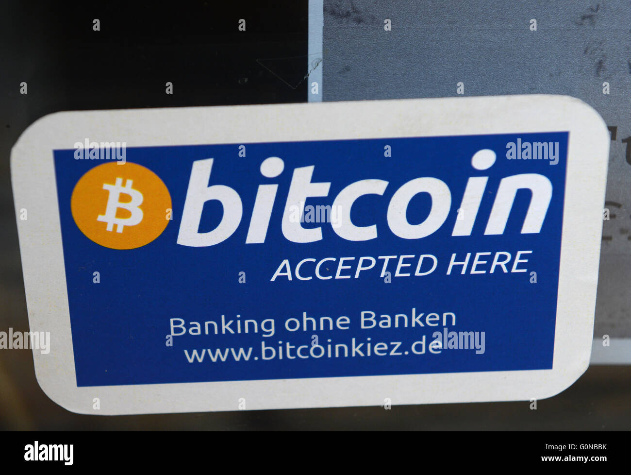 "Bitcoin accepted here" is posted at the entrance to a bar in Berlin