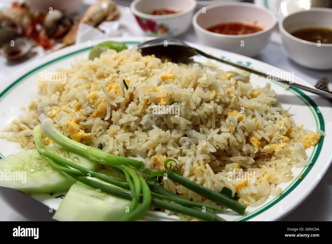 Egg Fried rice, Chinese cuisine with spring onion and cucumber slide Stock Photo