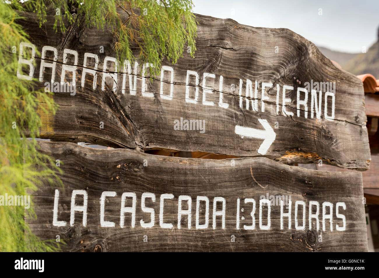 Old rustic wooden sign at the start of the barranco del infierno walk in Adeje, Tenerife, Canary Islands, Spain. Stock Photo