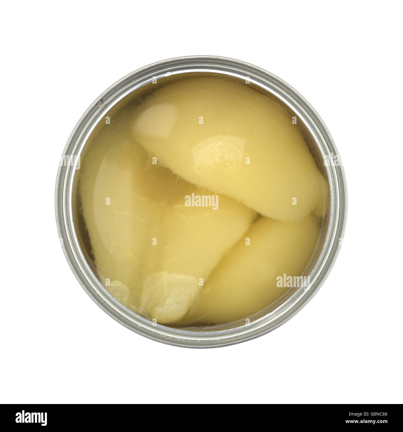 Top view of an opened can of pear halves isolated on a white background. Stock Photo