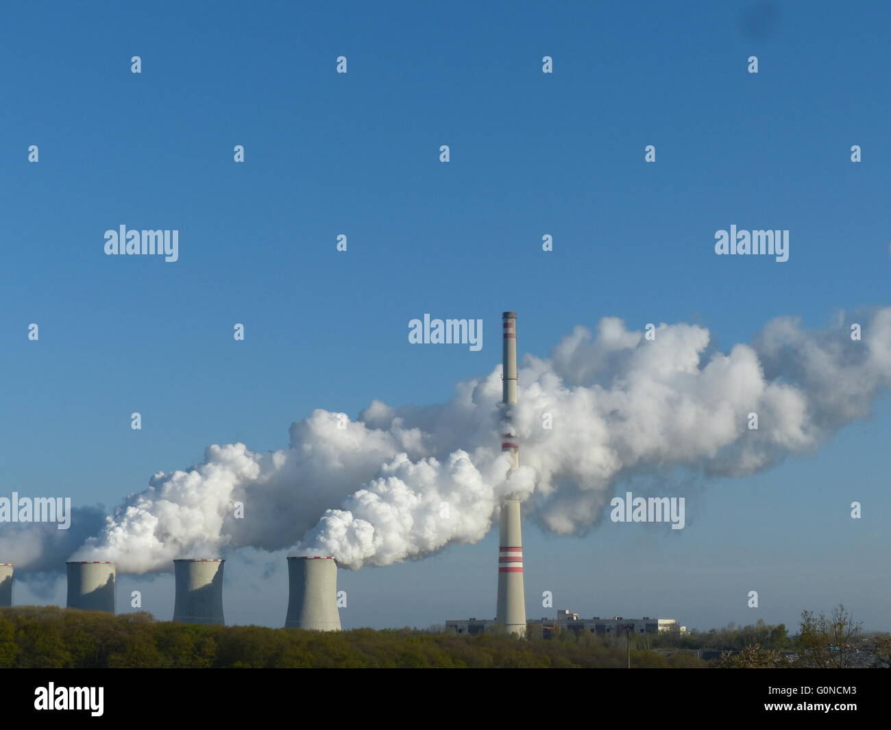 Factory chimneys spitting out smoke Stock Photo