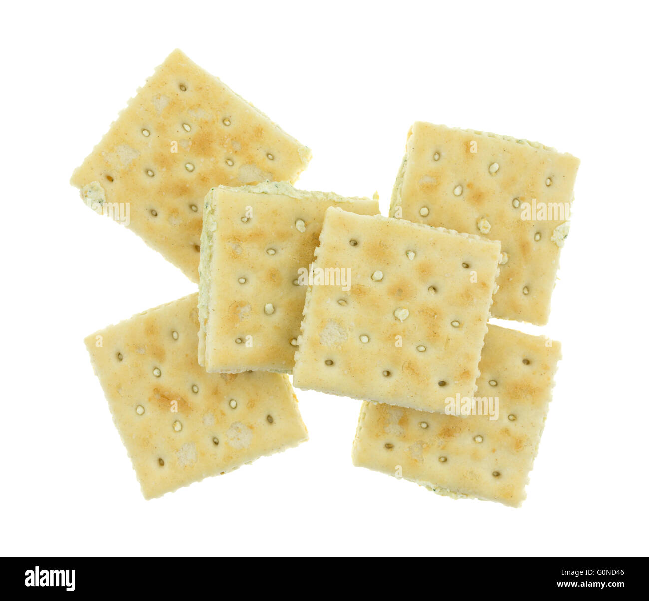 Top view of several cream cheese and chives crackers isolated on a white background. Stock Photo