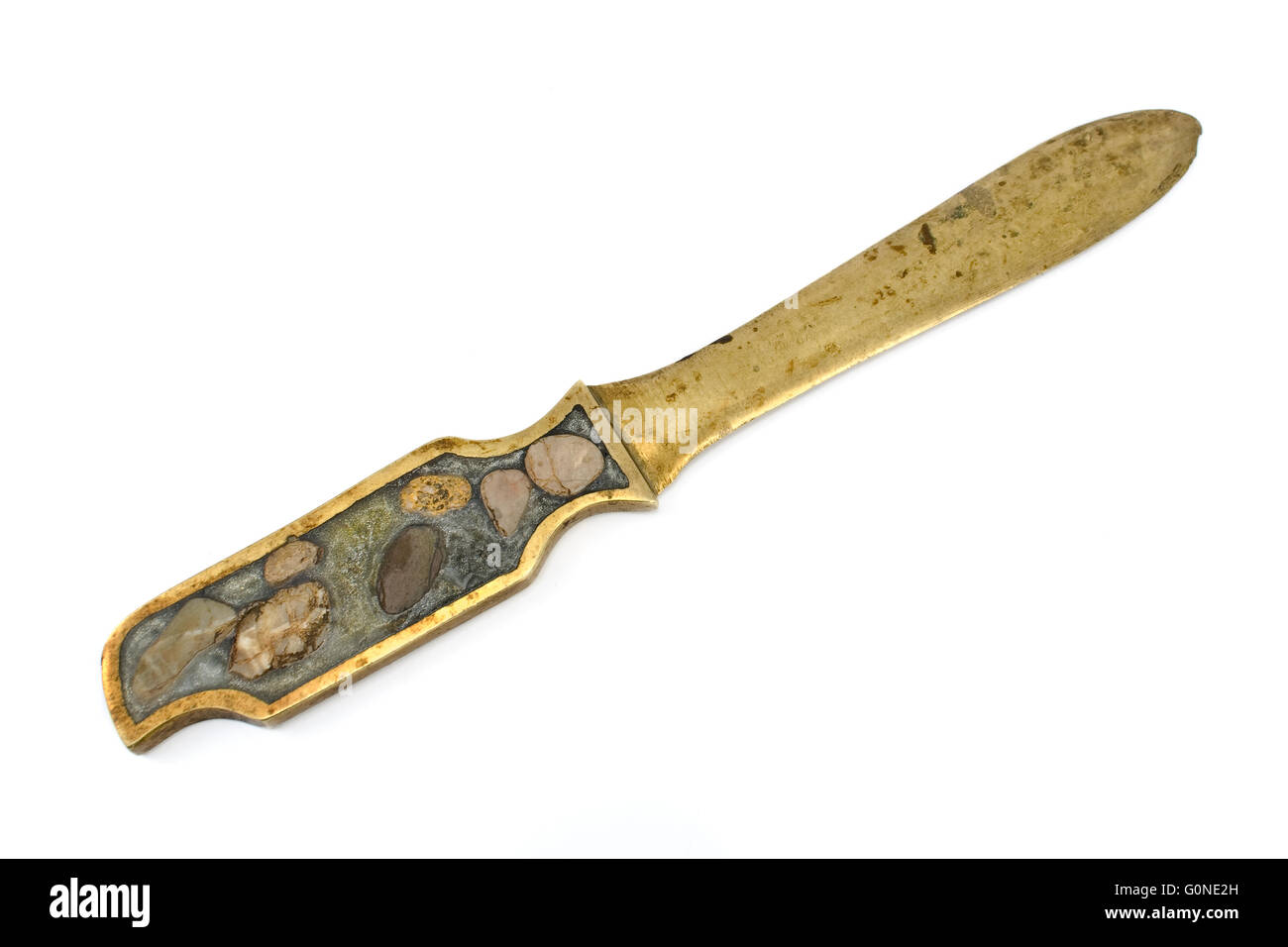 Antique letter opener brass knife isolated on white Stock Photo