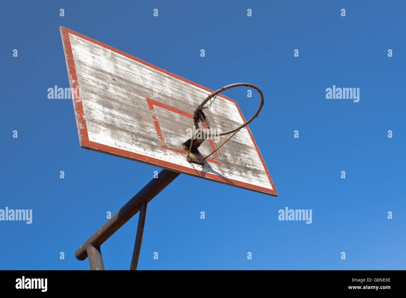 Old basketball hoop over blue sky Stock Photo
