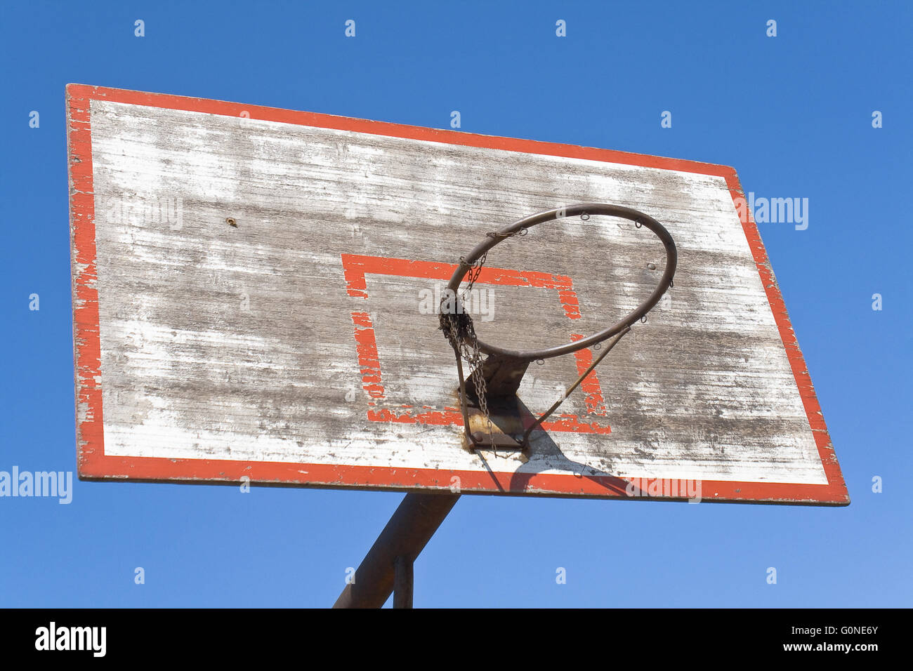 Old basketball hoop over blue sky Stock Photo
