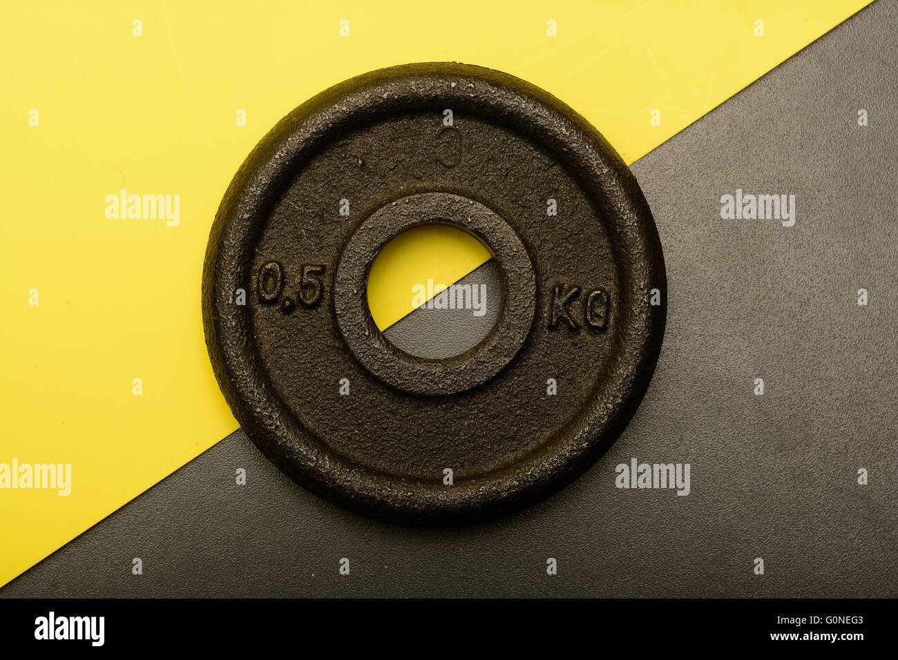 metal weight lifting disc on abstract background Stock Photo