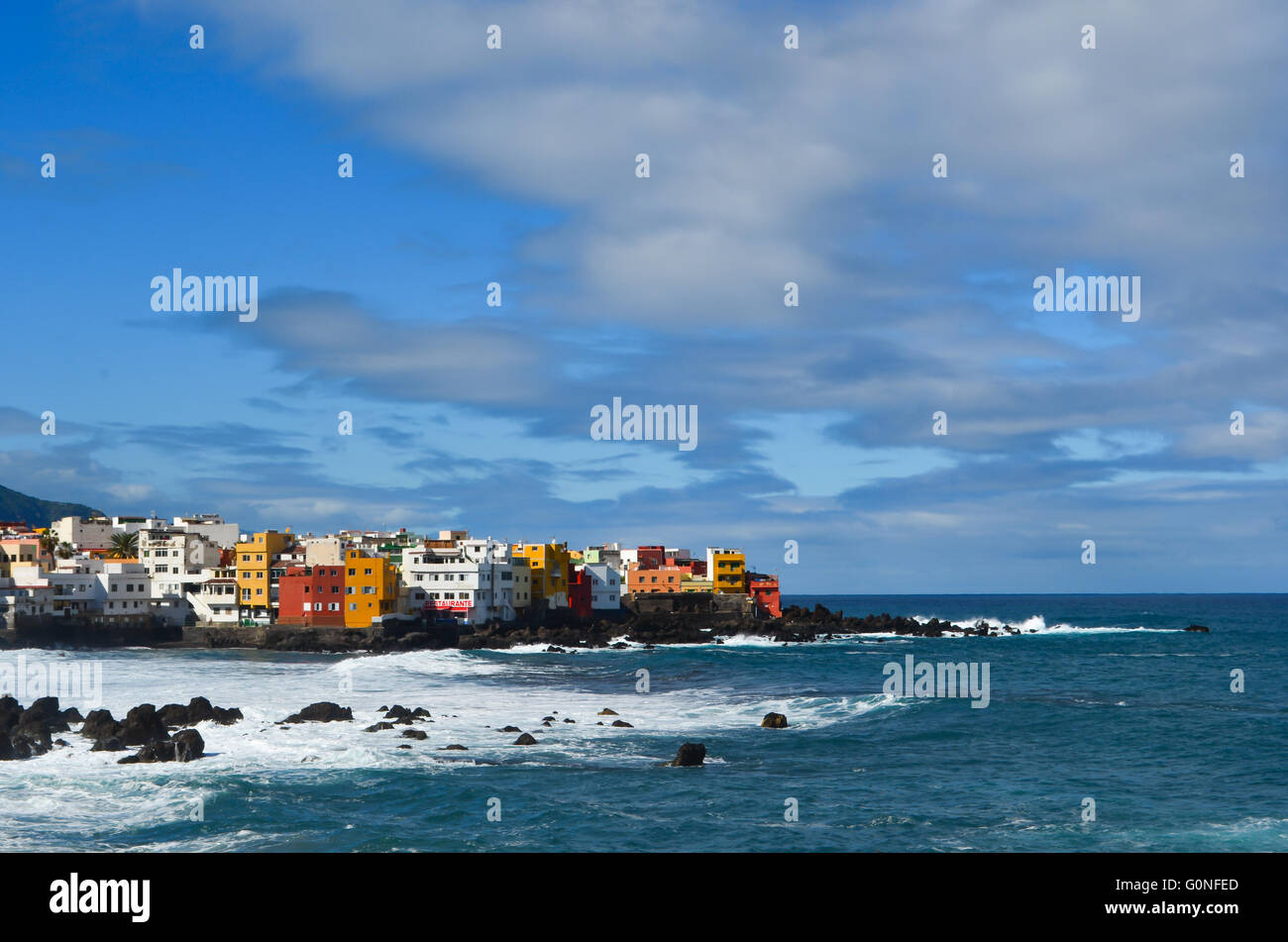 A town made of coloured houses in front of the sea Stock Photo - Alamy