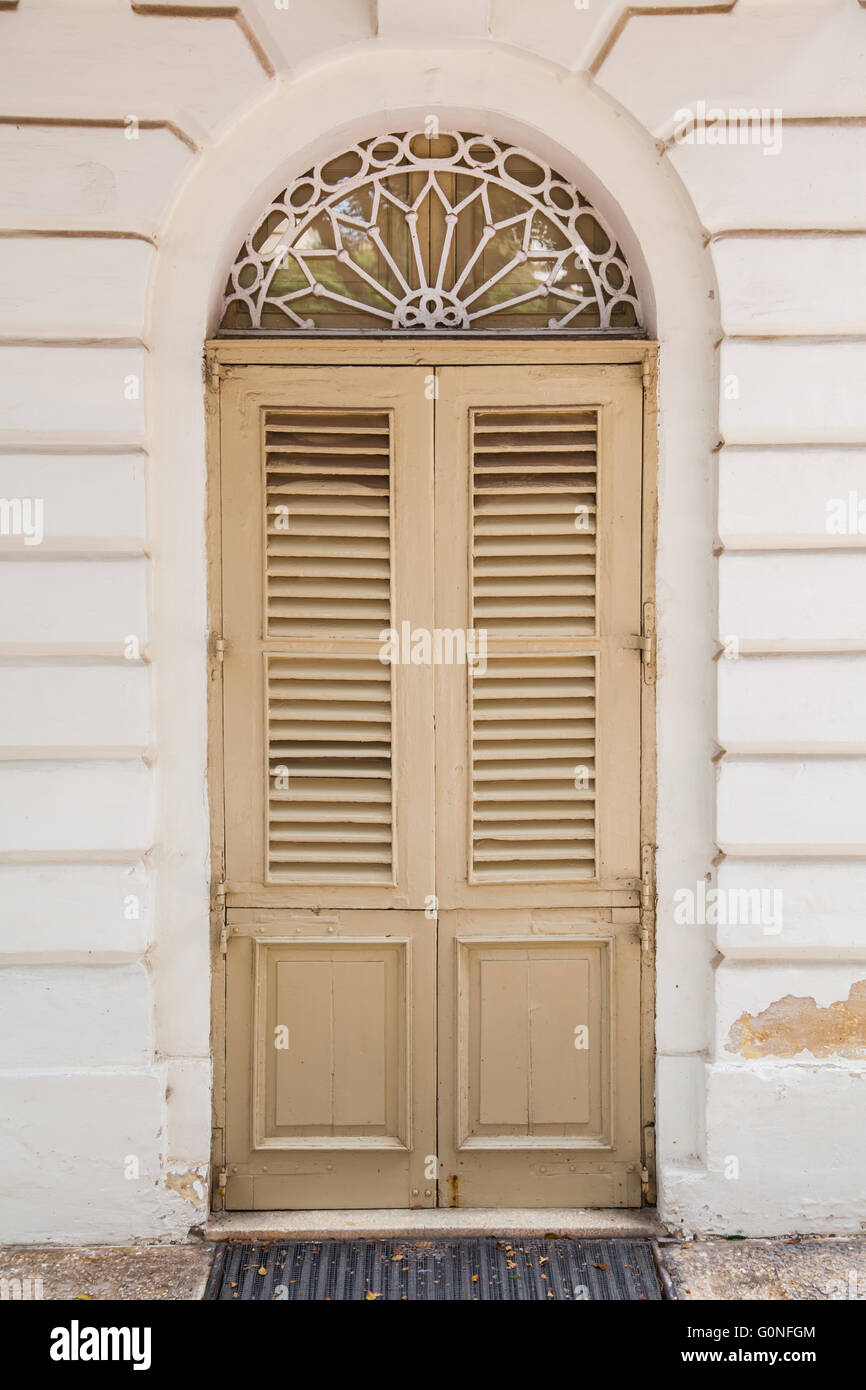 An old weathered french window with closed shutters Stock Photo - Alamy