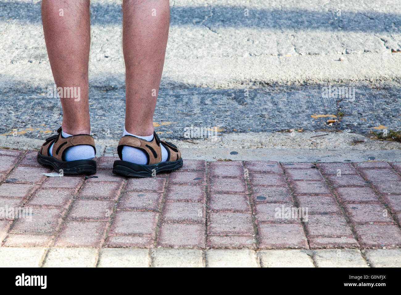 Funny unstyilish feet covered with socks and sandals Stock Photo - Alamy