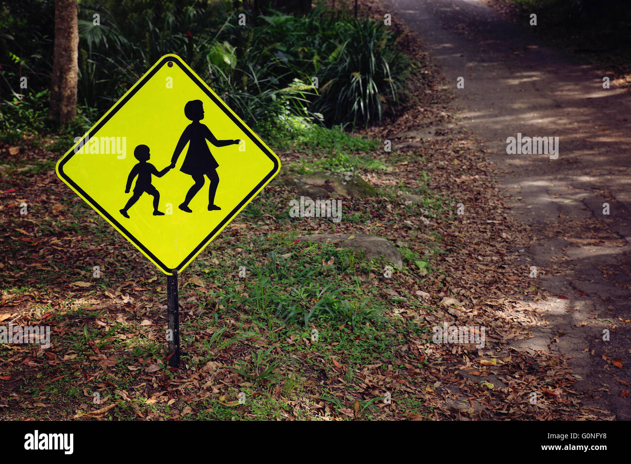 Rustic Yellow children crossing sign, vintage filter Stock Photo