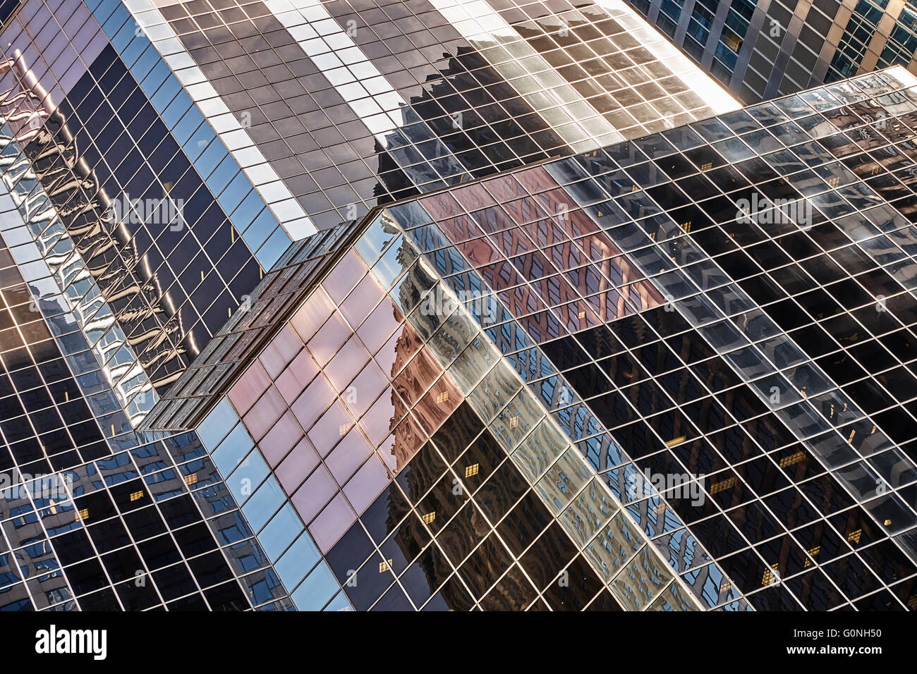 Modern office buildings with reflections of nearby skyscrapers Stock Photo