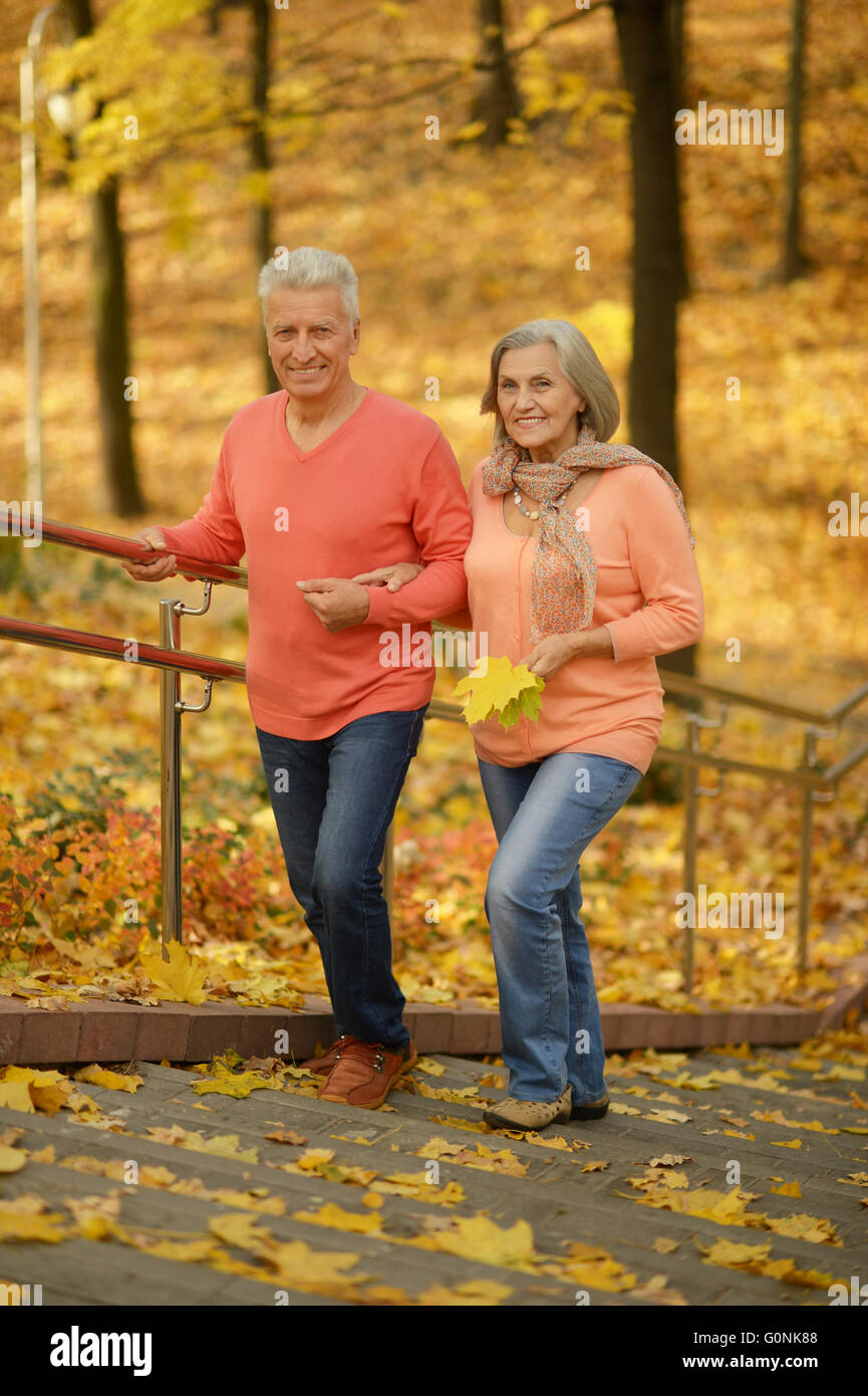 Mature couple in the autumn park Stock Photo - Alamy