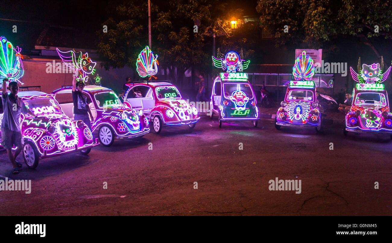 Colorful rickshaws in Yogykarta at night Stock Photo - Alamy