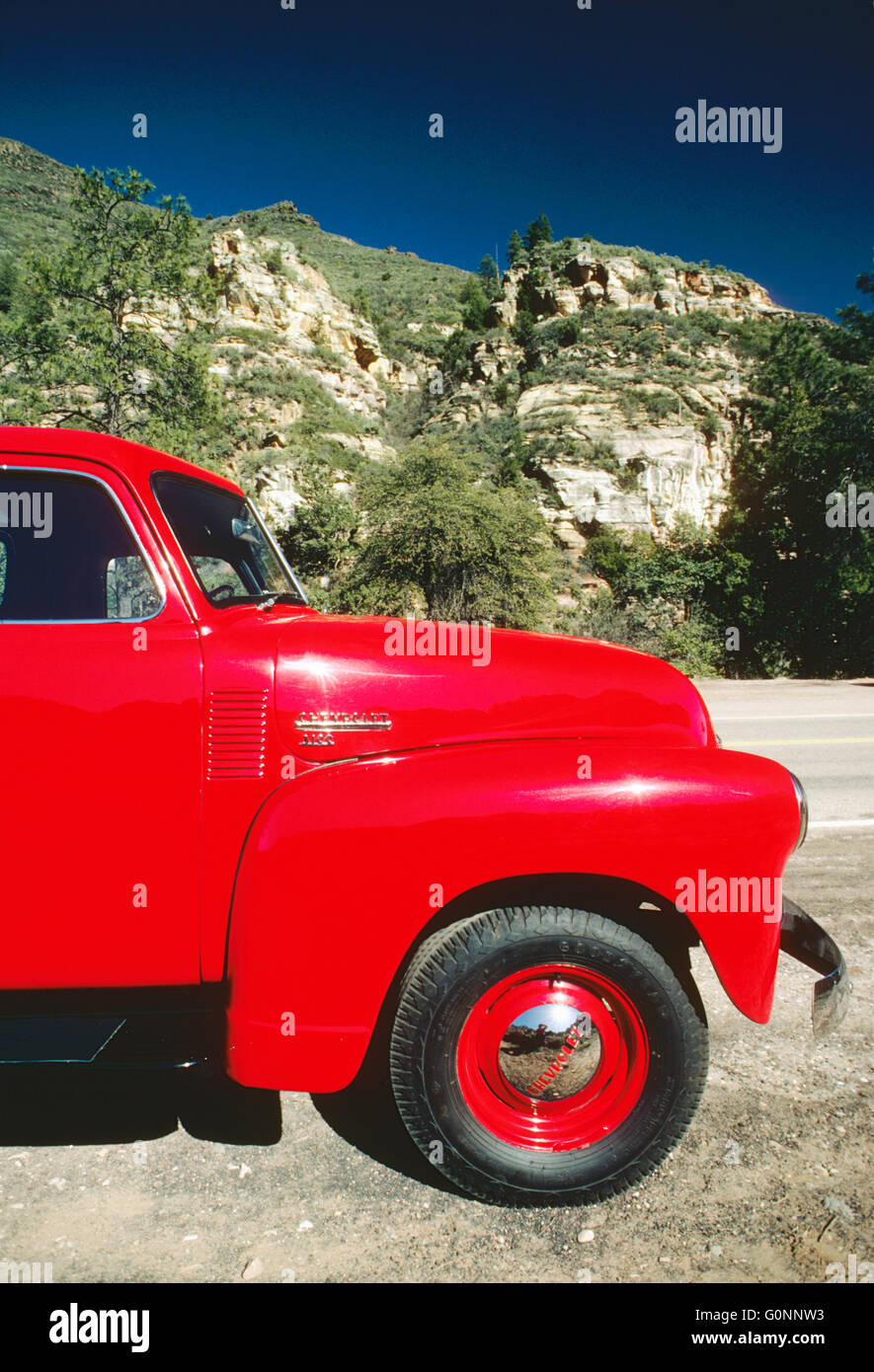 BRIGHT CHERRY RED 1950 CHEVROLET PICK UP TRUCK; OAK CREEK CANYON; SEDONA; ARIZONA; USA Stock Photo