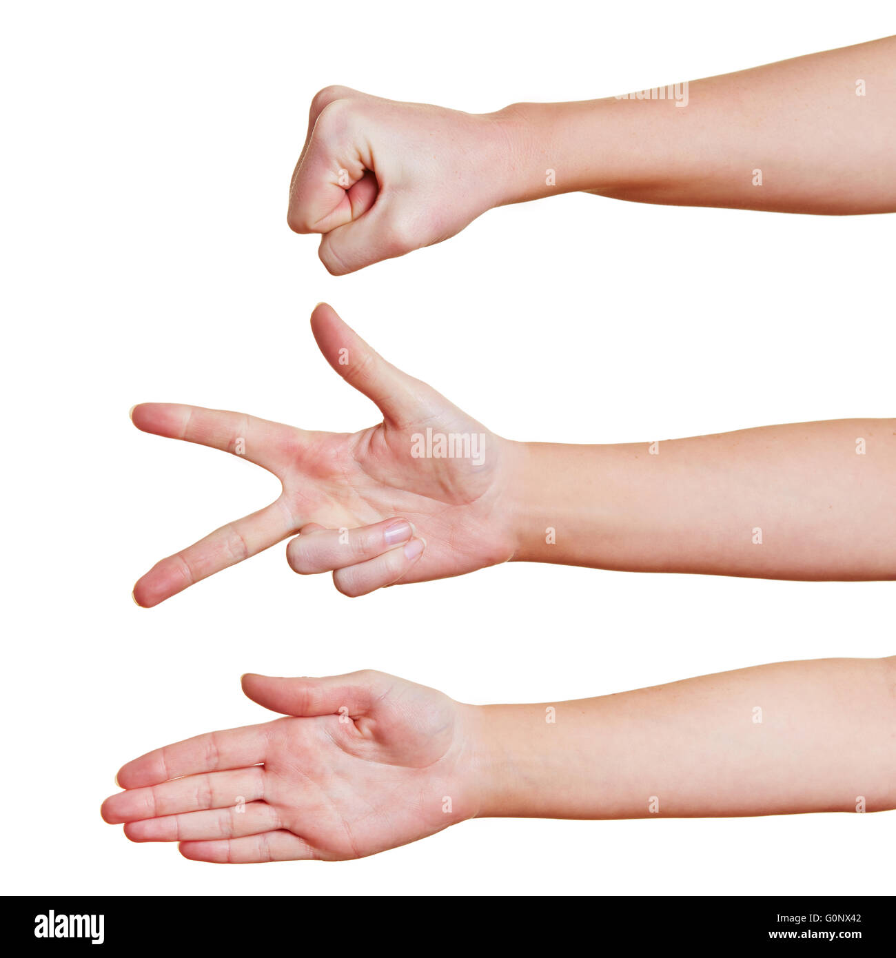 Hands showing the symbols rock paper scissors for a hand game Stock Photo