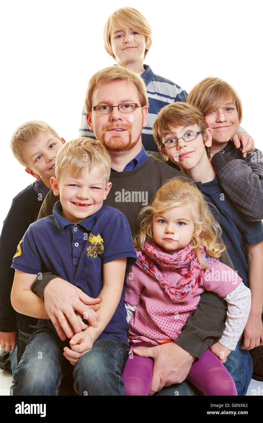 Portrait of a happy father with five sons and a daughter Stock Photo