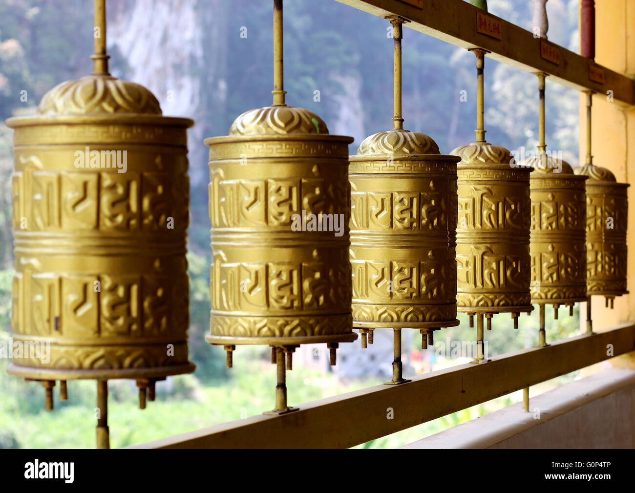 Buddhist prayer wheels which is an important and prominent feature in a Tibetan monastery or temple. Stock Photo