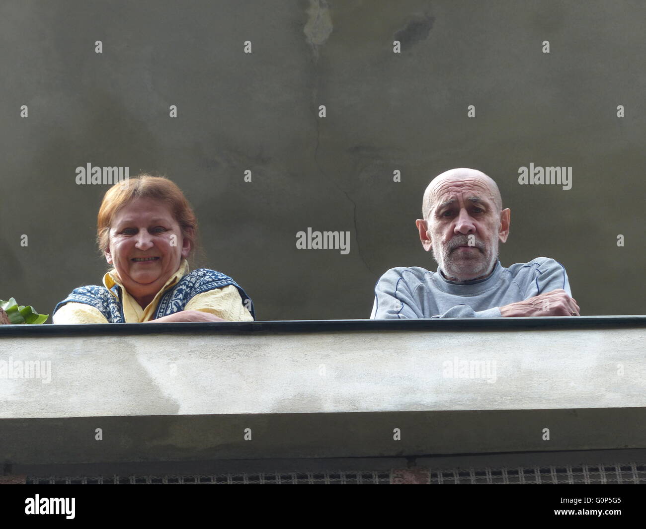 older couple looking out of balcony Stock Photo