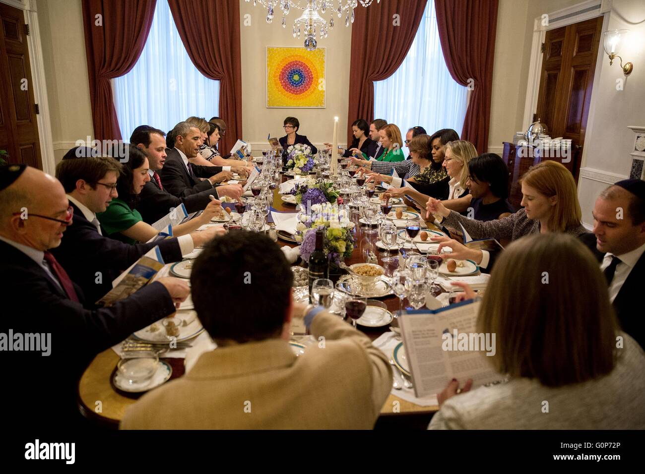 U.S President Barack Obama and First Lady Michelle Obama host a Passover Seder dinner with friends and staff in the Old Family Dining Room of the White House April 28, 2016 in Washington, D.C. Stock Photo