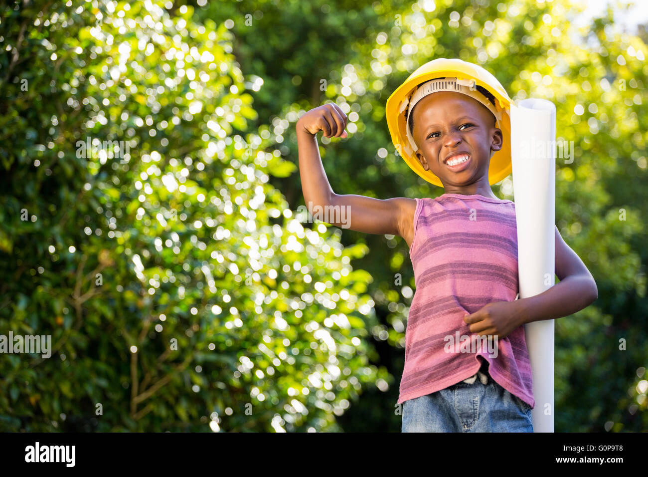 Boy is wearinf a hardhat Stock Photo