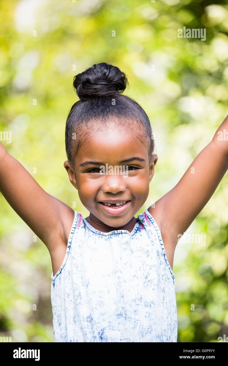 Smiling little girl looking at the camera Stock Photo - Alamy