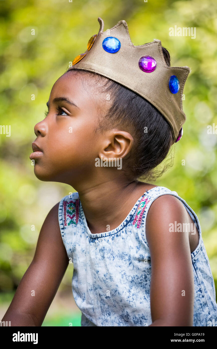 Girl wearing a king crown Stock Photo