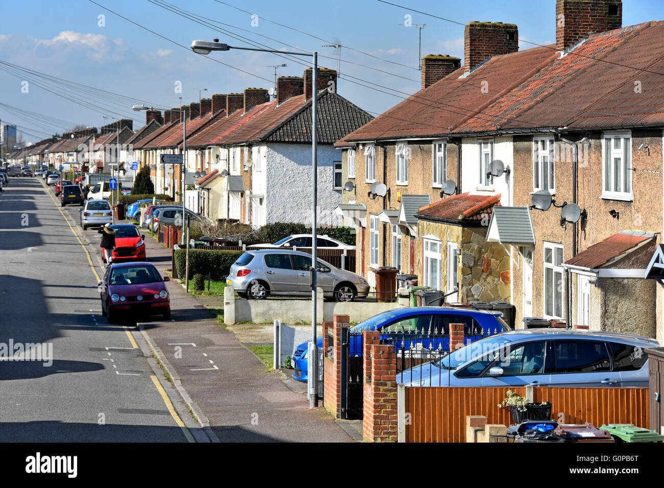 Typical street on Becontree estate built between the wars as massive LCC social council housing development now part private Barking and Dagenham UK Stock Photo