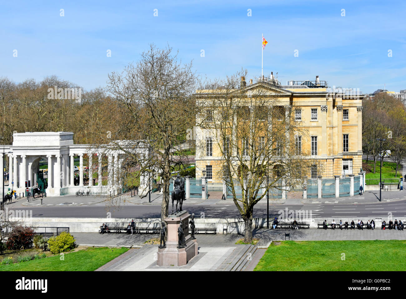 Historical Apsley House museum & London town house of Duke of Wellington & white Hyde Park Corner Screen & Wellington statue winter trees England UK Stock Photo