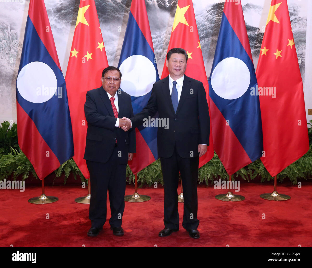 Beijing, China. 3rd May, 2016. Chinese President Xi Jinping (R) holds talks with Lao President Bounnhang Vorachit in Beijing, capital of China, May 3, 2016. Credit:  Pang Xinglei/Xinhua/Alamy Live News Stock Photo