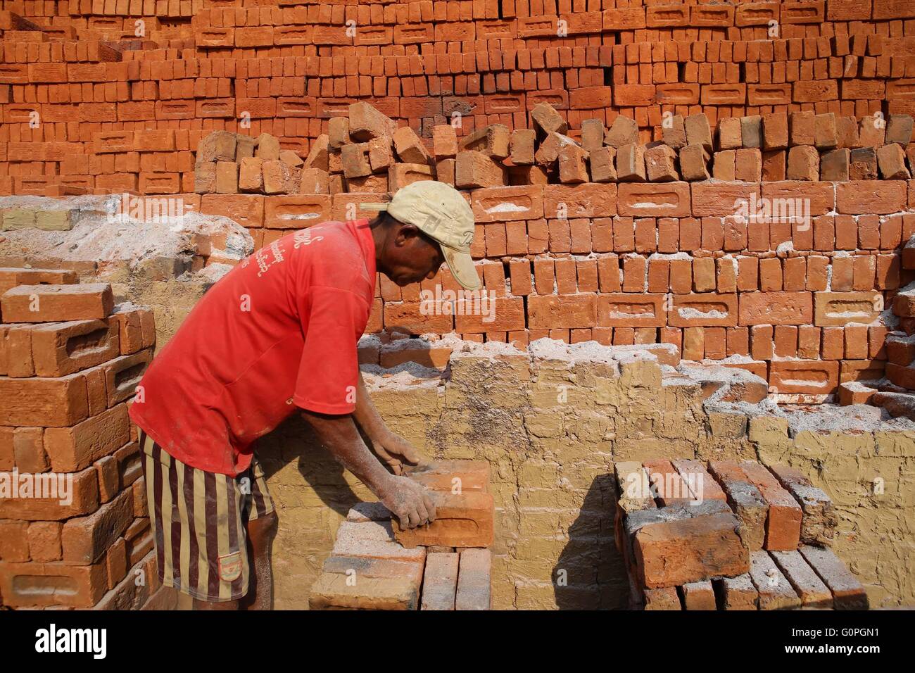 Yangon, Myanmar. 3rd May, 2016. A laborer works at a brick factory on the outskirts of Yangon
