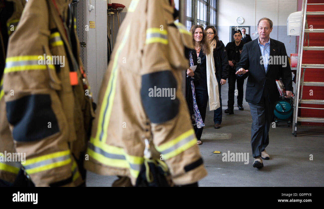 Berlin, Germany. 04th Apr, 2016. American Ambassador to Germany John B. Emerson (R) visits the Suarez fire station on St. Florian's Day, the feast of St. Florian, patron saint of firefighters, in Berlin, Germany, 04 April 2016. Photo: BERND VON JUTRCZENKA/dpa/Alamy Live News Stock Photo