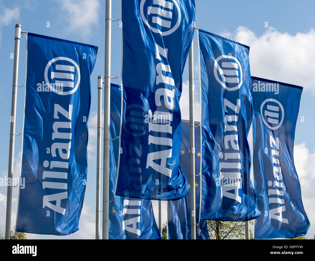 Munich, Germany. 04th Apr, 2016. Blue flags written with 'Allianz' wave ahead of the Allianz general assembly in Munich, Germany, 04 April 2016. Photo: PETER KNEFFEL/dpa/Alamy Live News Stock Photo