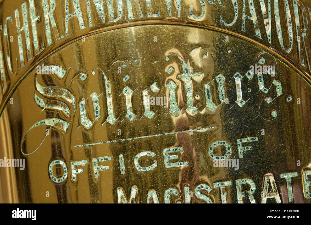 old brass solicitors sign on wall outside office Stock Photo