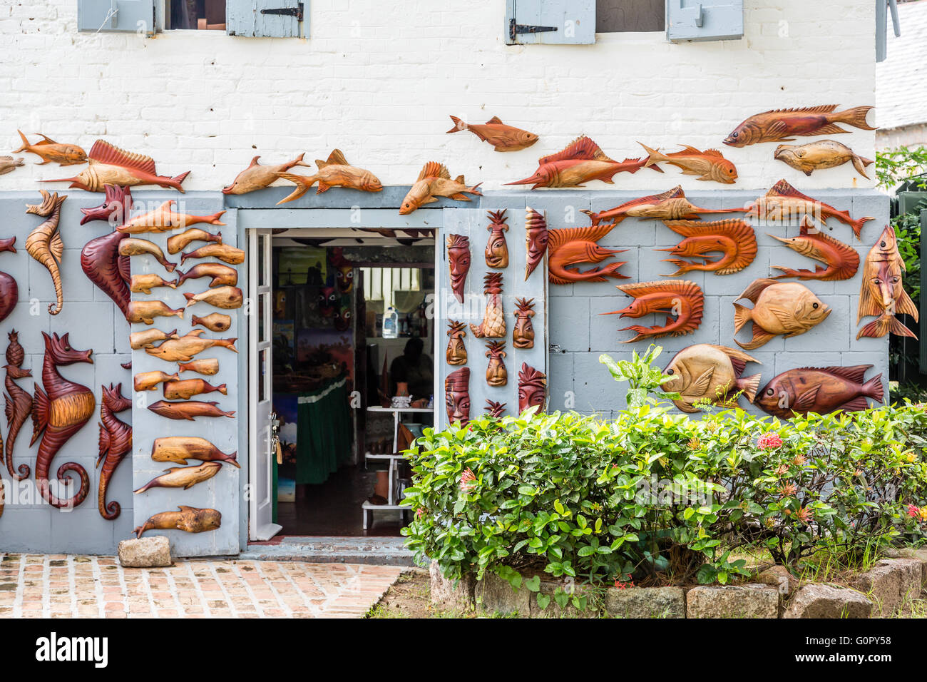 Wood Carving Workshop on Antigua with displayed art Stock Photo
