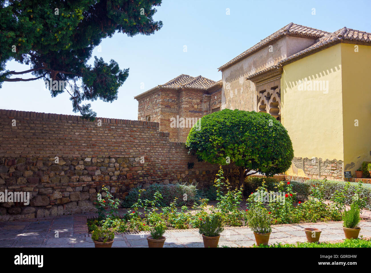 Courtyards and gardens of the famous Palace of the Alcazaba in Malaga Spain Stock Photo