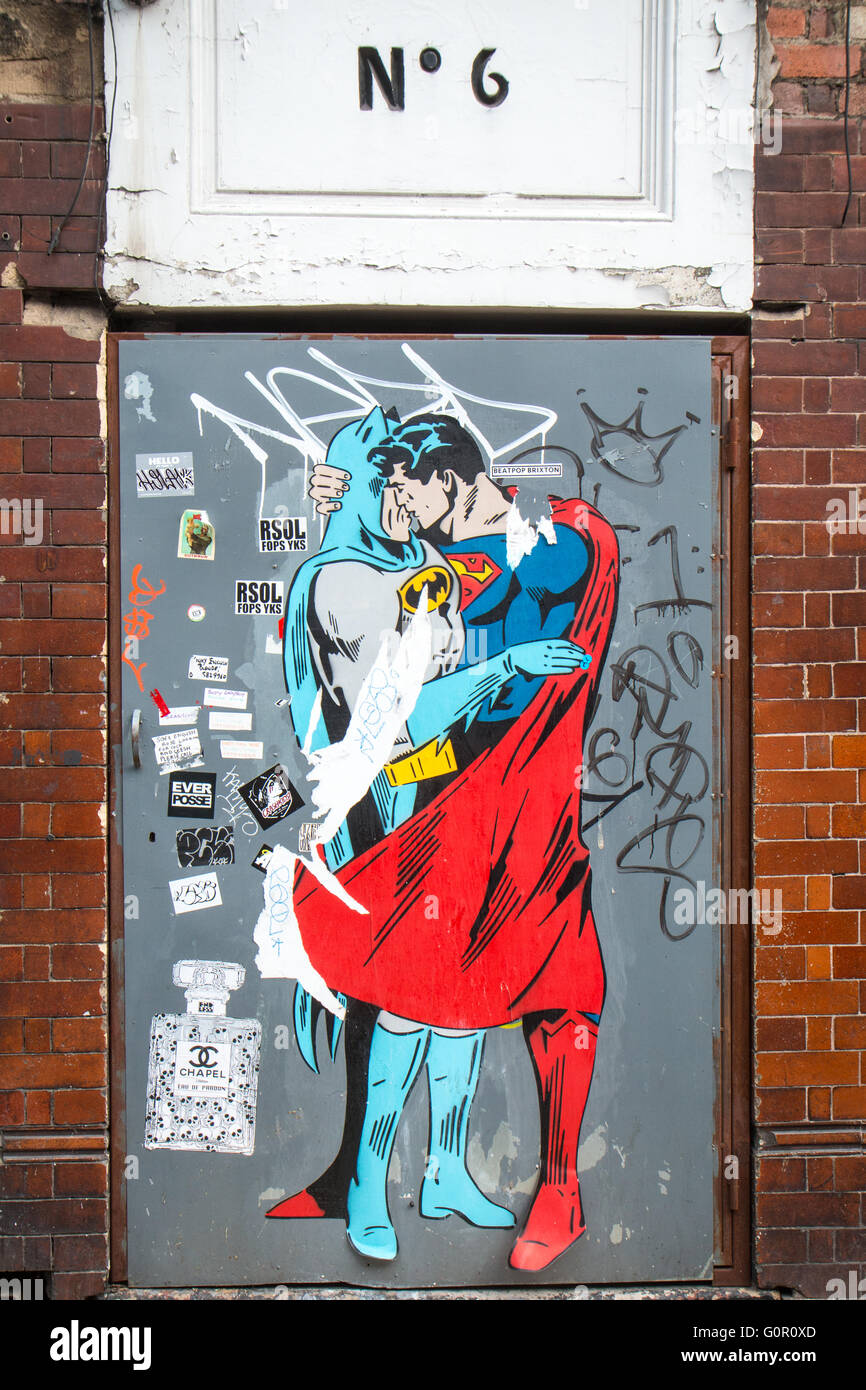 Batman kissing superman Stock Photo - Alamy