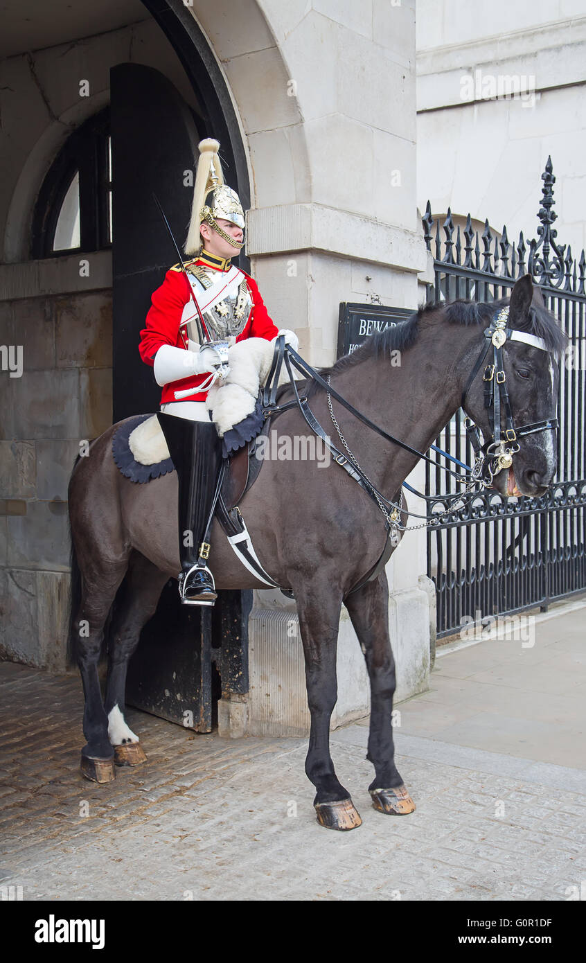 WINDSOR - APRIL 17: Unidentified man on the horse, guard protecting entrance to the Whitehall palace on April 17, 2016 in London Stock Photo