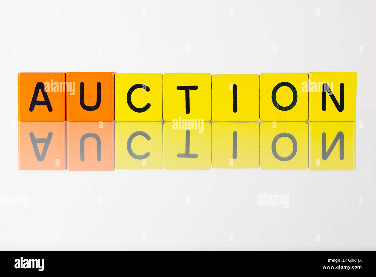 Auction - an inscription from children's wooden blocks Stock Photo