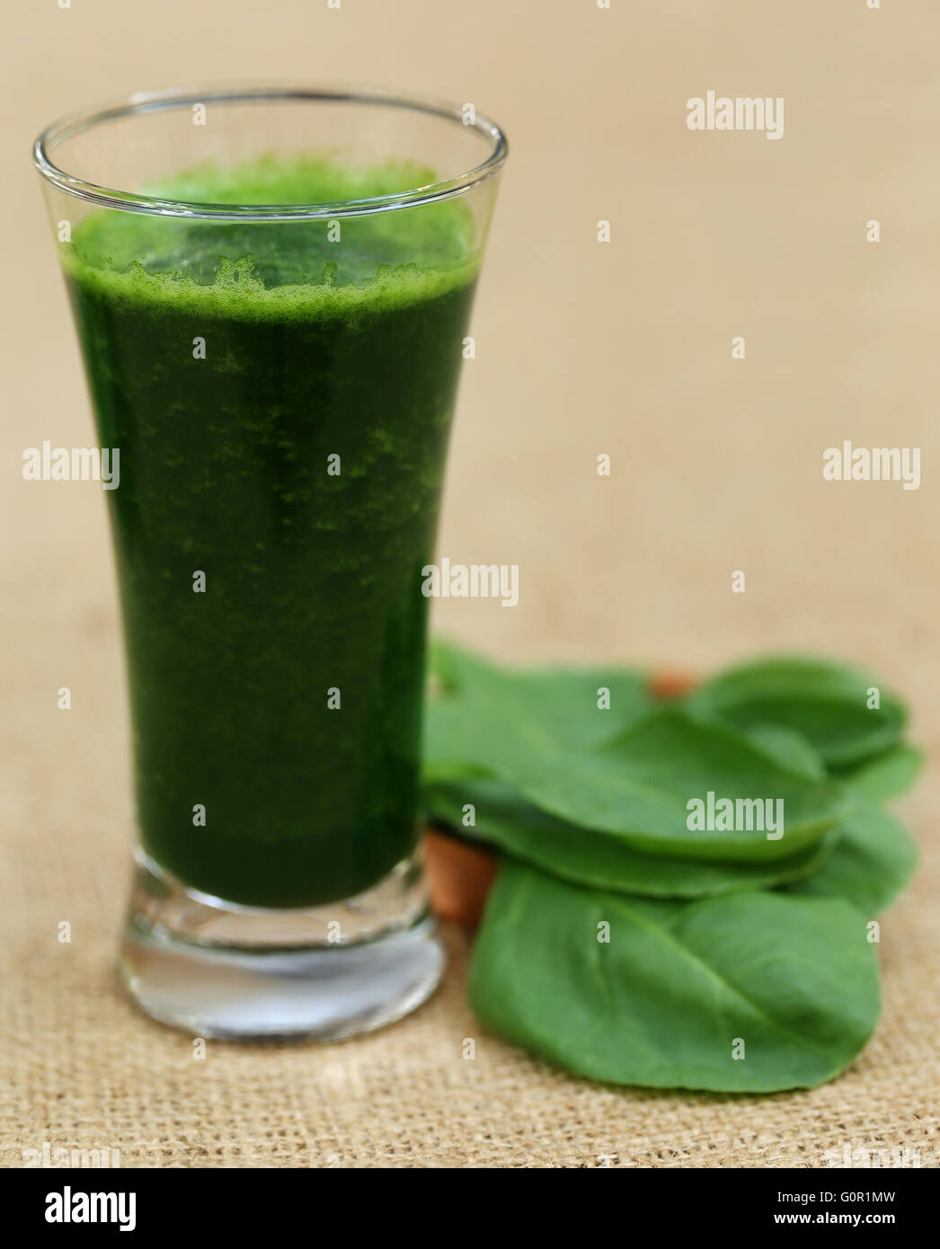 Juice of spinach in a glass Stock Photo - Alamy