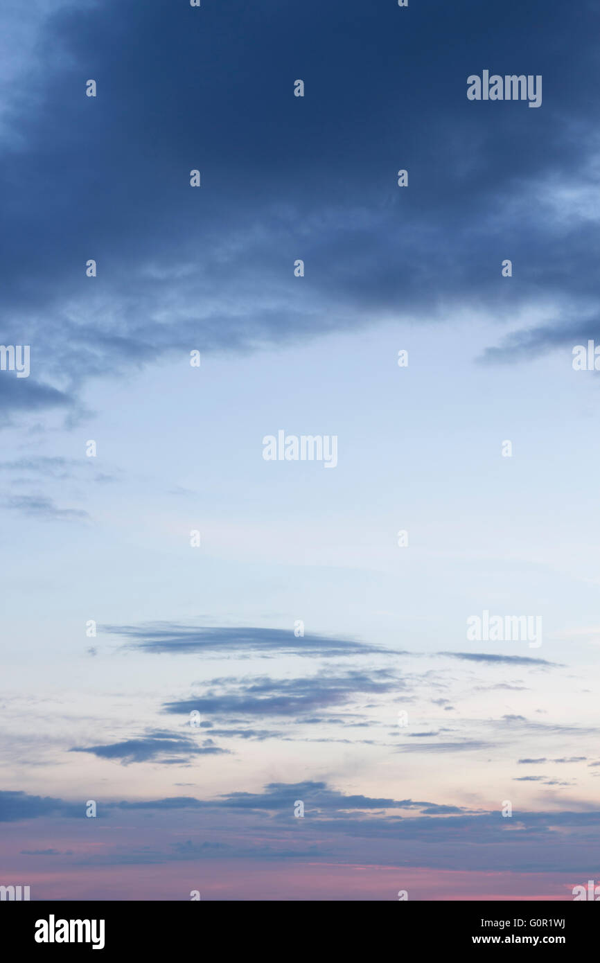 Sunset blue sky with clouds color photo Stock Photo - Alamy