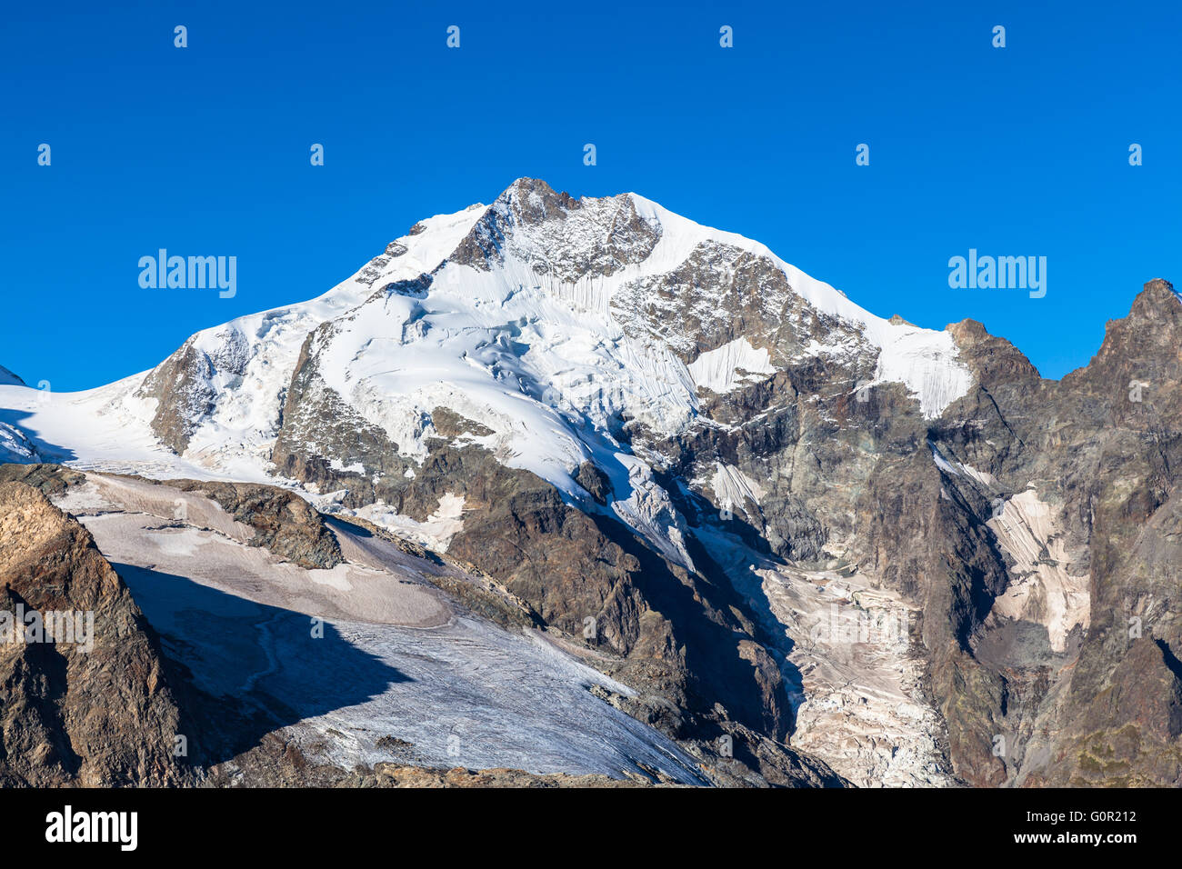 Close view of the Piz Bernina from Diavolezza on a sunny day. It is the  the highest mountain in the Eastern Alps and in swiss C Stock Photo