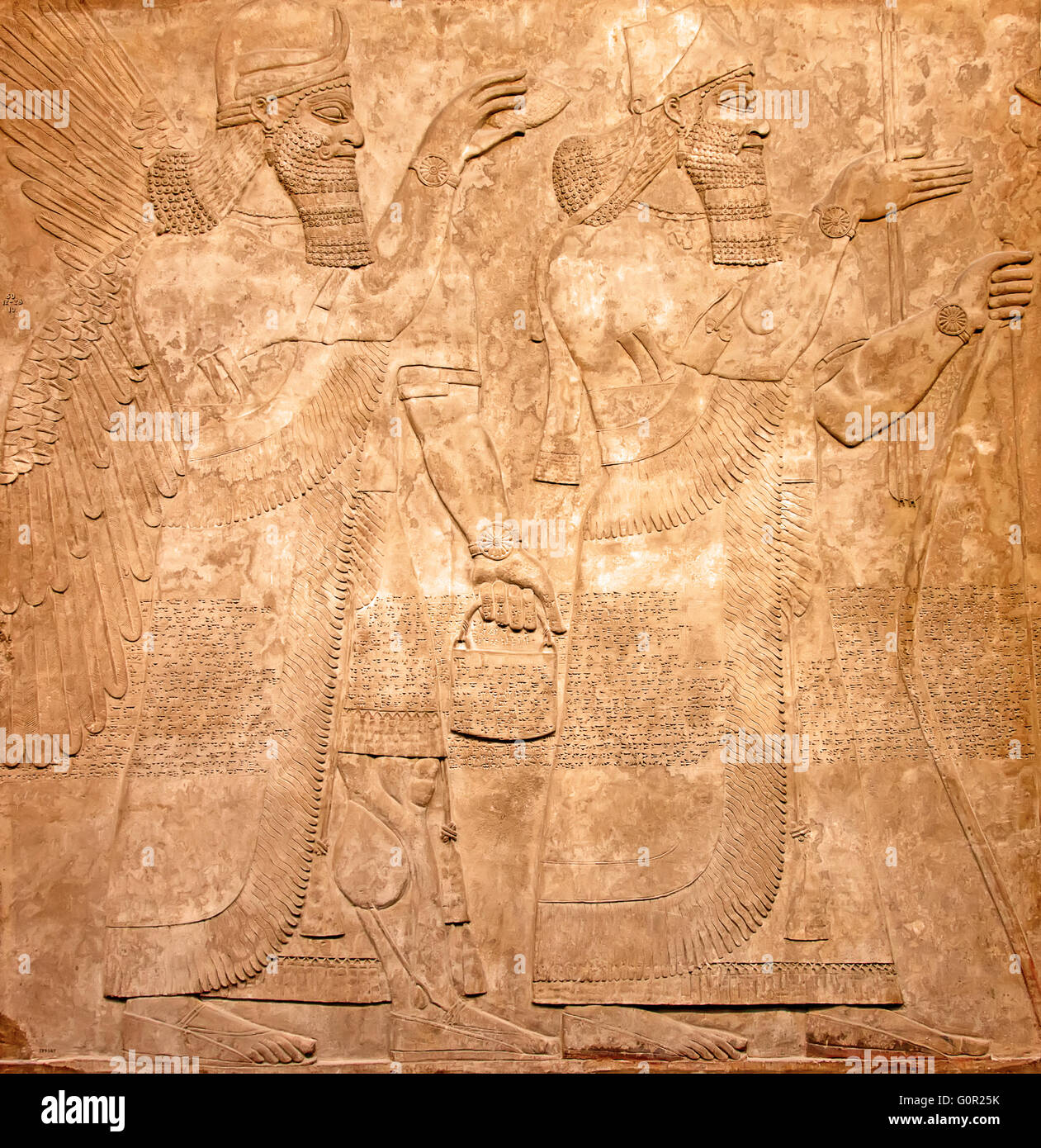 Ancient sumerian stone carving with cuneiform scripting Stock Photo